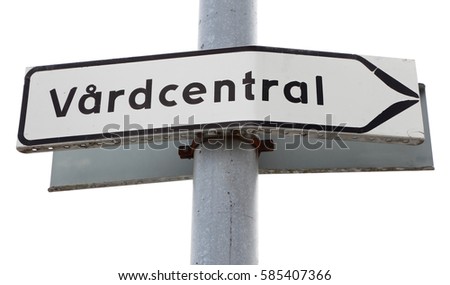 Generic signpost with direction to a Swedish health care center (vardcentral).