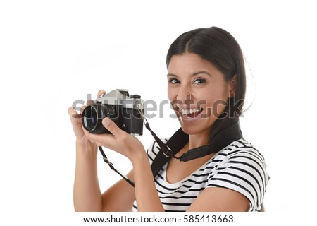 young attractive latin woman taking pictures posing smiling happy using cool retro and vintage photographic camera smiling happy in photography hobby having fun learning pro photo shooting 