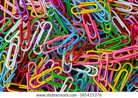 colored paper clips Royalty-Free Stock Photo #585415376