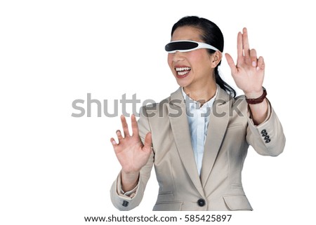 Businesswoman using virtual video glasses against white background