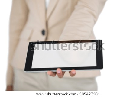 Mid section of Businesswoman holding digital tablet on white background