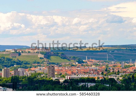 Stunning landscape roadside view with old small village and castle background in countryside Germany.