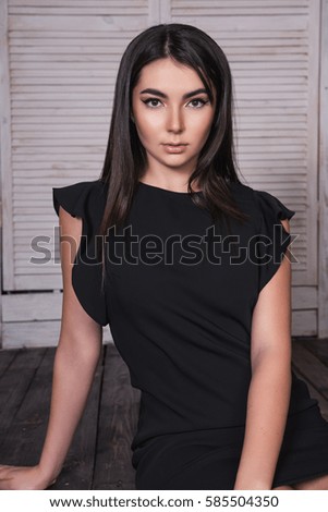 Brunette woman with fashion hairstyle and Holiday Make-up. Beauty portrait of female face