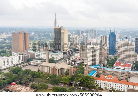Panoramic top view on central business district of Nairobi from helipad on the roof of Kenyatta International Conference Centre (KICC) building at overcast day. Kenya.