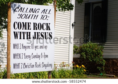 Come Rock with Jesus Sign in front of white church