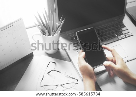 Business on the desk with a laptop computer and a mobile phone works.