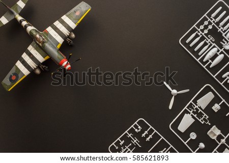 Scale model of the airplane fighter with details. Background Royalty-Free Stock Photo #585621893