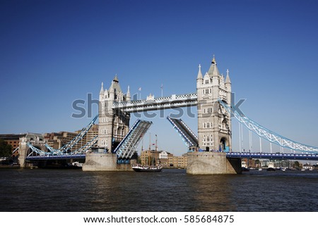 Tower Bridge, lifted, on a bright sunny day.