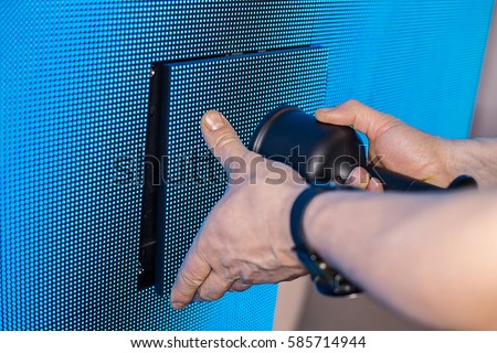 Manual assembling of the LED screen cluster - close up background with shallow depth of field