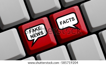 Red Computer Keyboard with balloons showing Fake News or Facts Royalty-Free Stock Photo #585719204