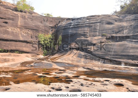 Natural stone in the forest  at the waterfall. 