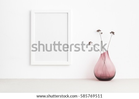Empty frame and decorative plant.
