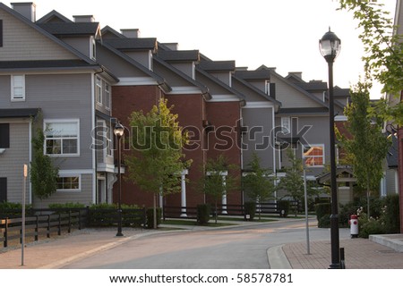Several upscale townhouses on a quiet street