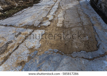 Due to technology of violations in construction of roads, Extreme cold and heavy rains washed away asphalt road and formed numerous cracks and dangerous failures