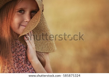girl in the hat on the field