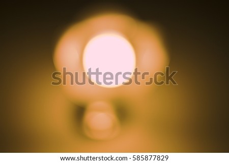 blurred lamp night light in a dark background. Vintage effect style picture.