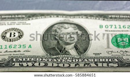 Closeup of the front of a two dollar bill.