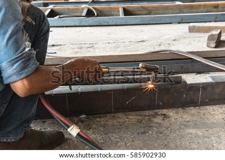 Steel welding of the beam under the truck. Such skillful crafting to joint the high strength steel bar. Picture also shows leaf spring those specially designed for the truck.