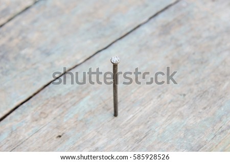metal nail inside wood