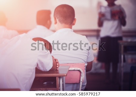 Student boy sleeping in classroom