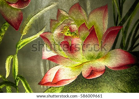 Vietnamese Lotus flower silk embroidery as a main element of the traditional Vietnamese embroidery pictures 