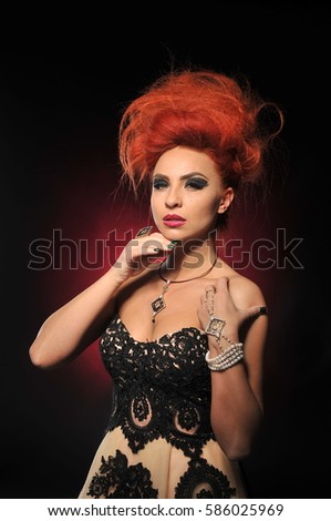 red hair girl model at the black background