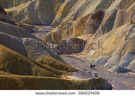 The beautiful erosional features of Zabriskie Point which is a part of the Amargosa Range located east of Death Valley in Death Valley National Park in California, Royalty-Free Stock Photo #586029608
