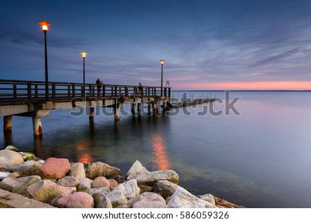 Wooden pier in Kuznica at dusk. Baltic Sea. Poland.
