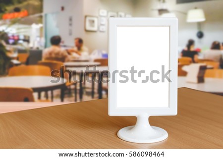 Label the blank menu frame on a table in the restaurant  is suitable for inserting the text of the customer.