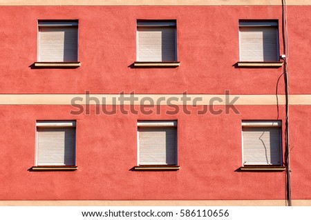 Facade of a building with six closed windows