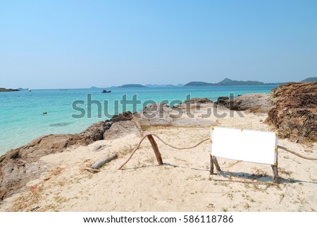 Blank white background signboard on tropical beach for your message