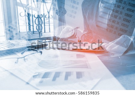 Business woman hand open notebooks and check document with on project at office desk in office and Set coin on book bank, Concept business and finance. The Picture Style Double exposure.