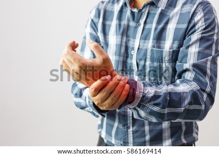 man suffering from elbow joint pain people /  healthcare and problem concept Royalty-Free Stock Photo #586169414