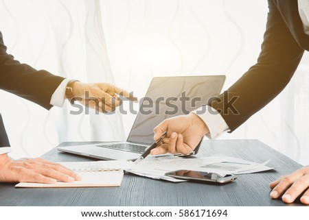 Businessmen using laptop smartphone closeup, Business man working at office with laptop sitting at wooden table, flare