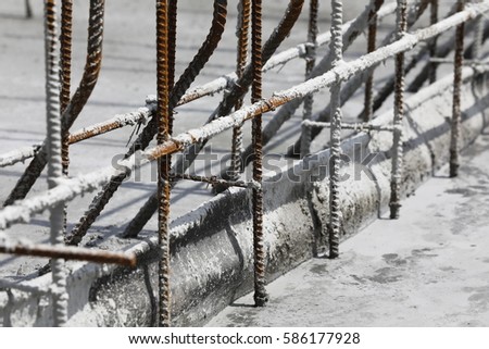 The wet concrete is poured on wire mesh steel reinforcement