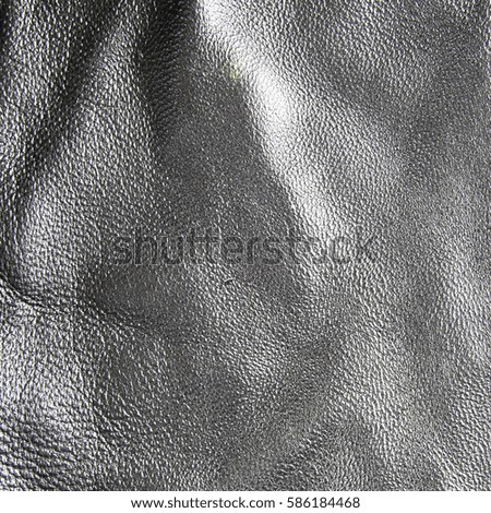 Texture of black leather with stitches