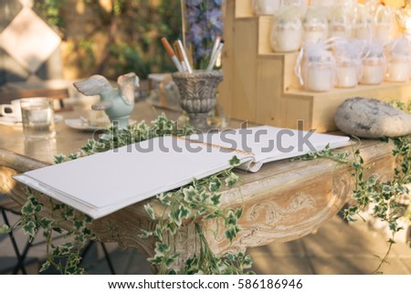 Guestbook on Table at Wedding Royalty-Free Stock Photo #586186946