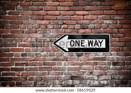 Grunge Brick Wall with Black and White One Way Sign
