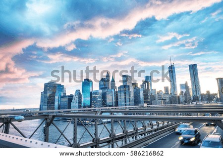 Sunset view of Downtown Manhattan from Brooklyn Bridge.