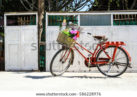 a vintage bicycle with a flower 