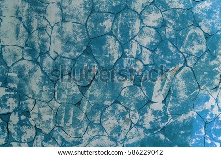 Cracked stone texture plastered white walls. Vintage cracks in white wall surface. Web small cracks on surface of white background. Traces of destruction of  old cement wall
