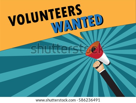 Hand holding megaphone to speech - Volunteers wanted Royalty-Free Stock Photo #586236491