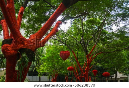tree decoration with red tape and lampion for Chinese New Year Celebration at Central Park Mall photo taken in Jakarta Indonesia