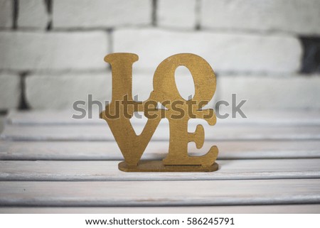 The word Love in gold color