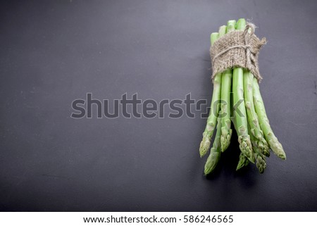Bunch of asparagus over slate background