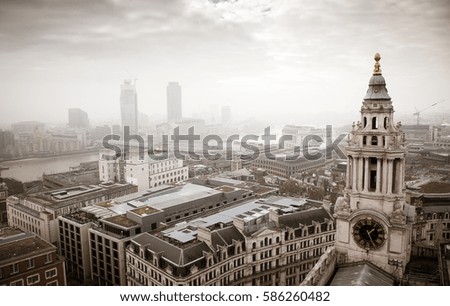rooftop view over London on a foggy day from St Paul's cathedral, UK