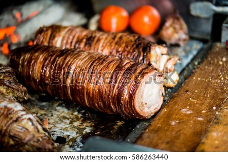Turkish Street Food Kokorec made with sheep bowel cooked in wood fired oven.
 Royalty-Free Stock Photo #586263440