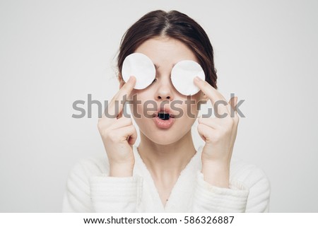 woman with a sponge wihte background cotton pad problem skin Royalty-Free Stock Photo #586326887