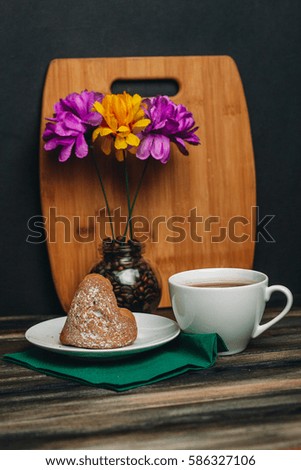 composition bouquet mug tea coffee cake on a plate