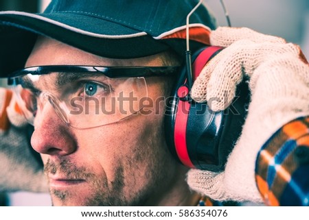 Worker Protection Equipment. Hearing Protectors and Glasses. Royalty-Free Stock Photo #586354076
